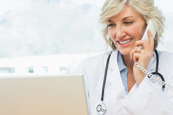 Locum tenens doctor on the phone with staffing agency